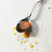 Spoon with raw unpasteurised pure organic honey zambian